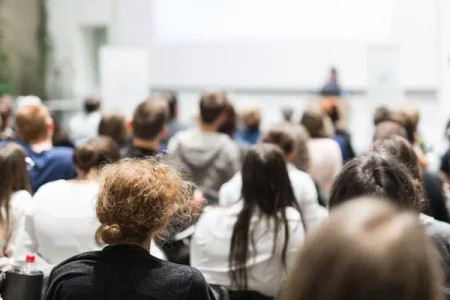 depositphotos_341734224-stock-photo-female-speaker-giving-presentation-lecture.webp